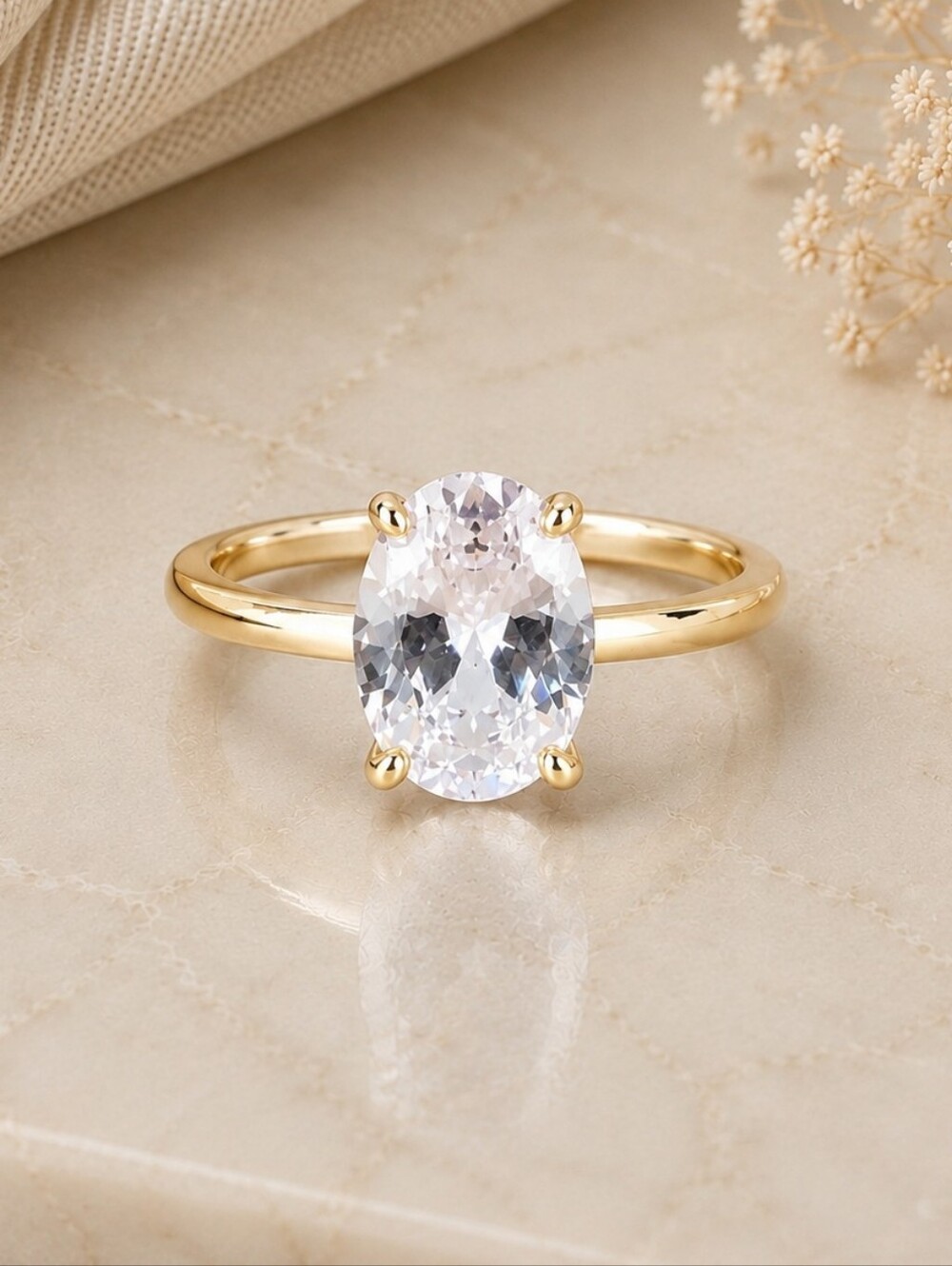 Classic Gold Oval Solitaire Ring with Clear Gemstone